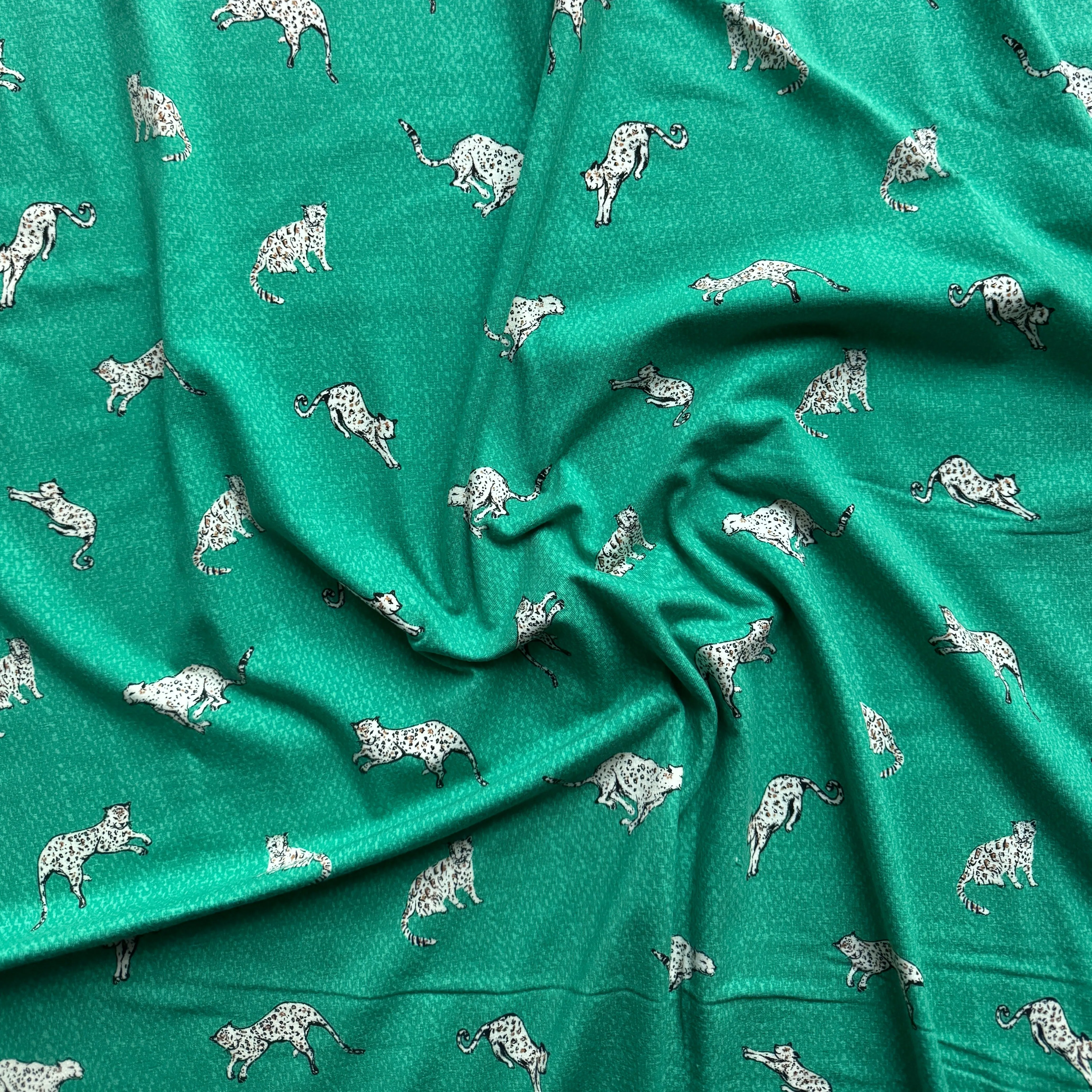 Art Gallery Stretch Knit fabric Wandering Leopards Sea per yard