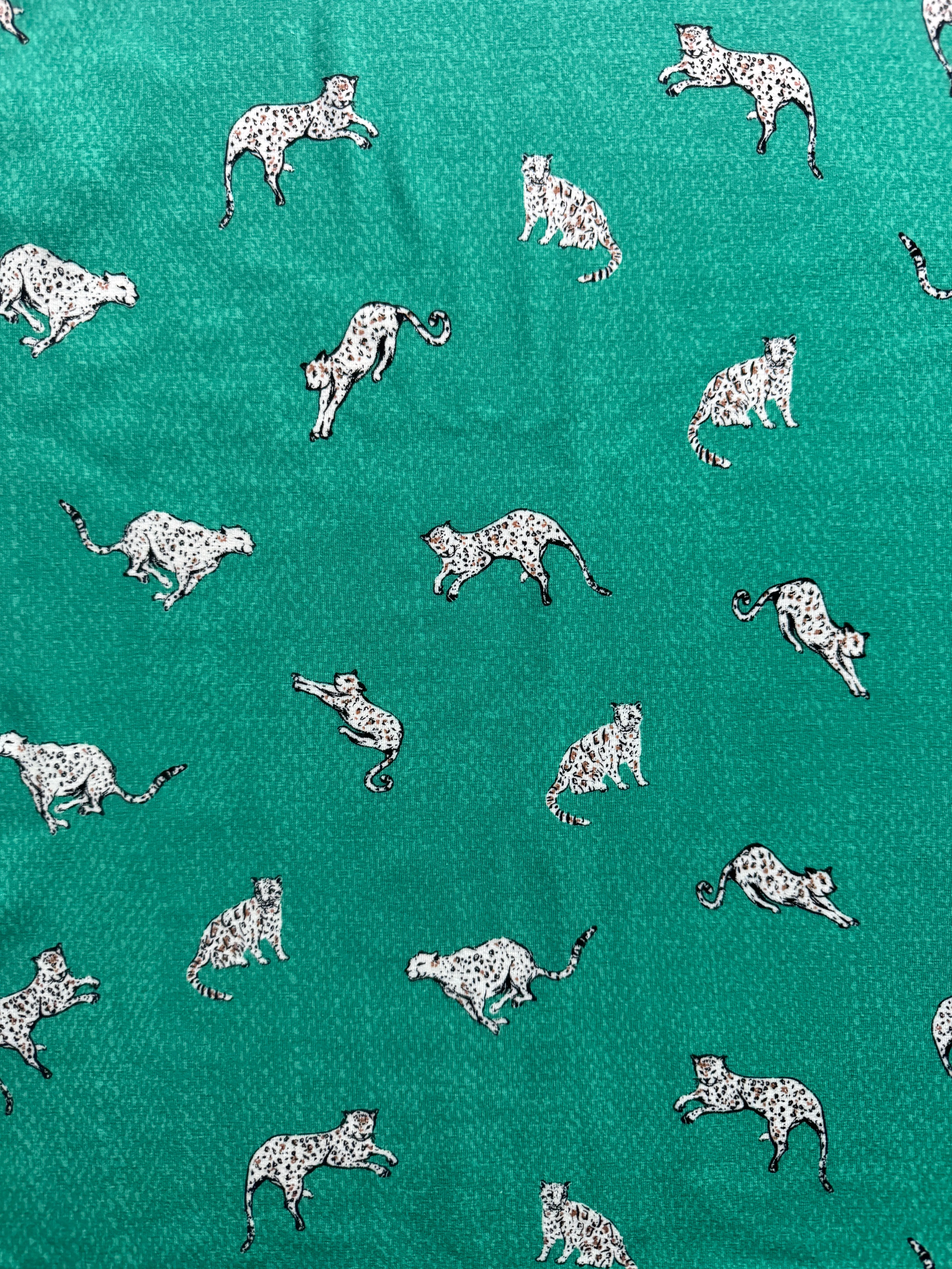 Art Gallery Stretch Knit fabric Wandering Leopards Sea per yard