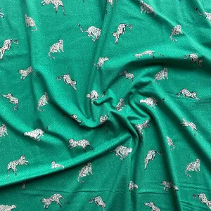 Art Gallery Stretch Knit fabric Wandering Leopards Sea per yard